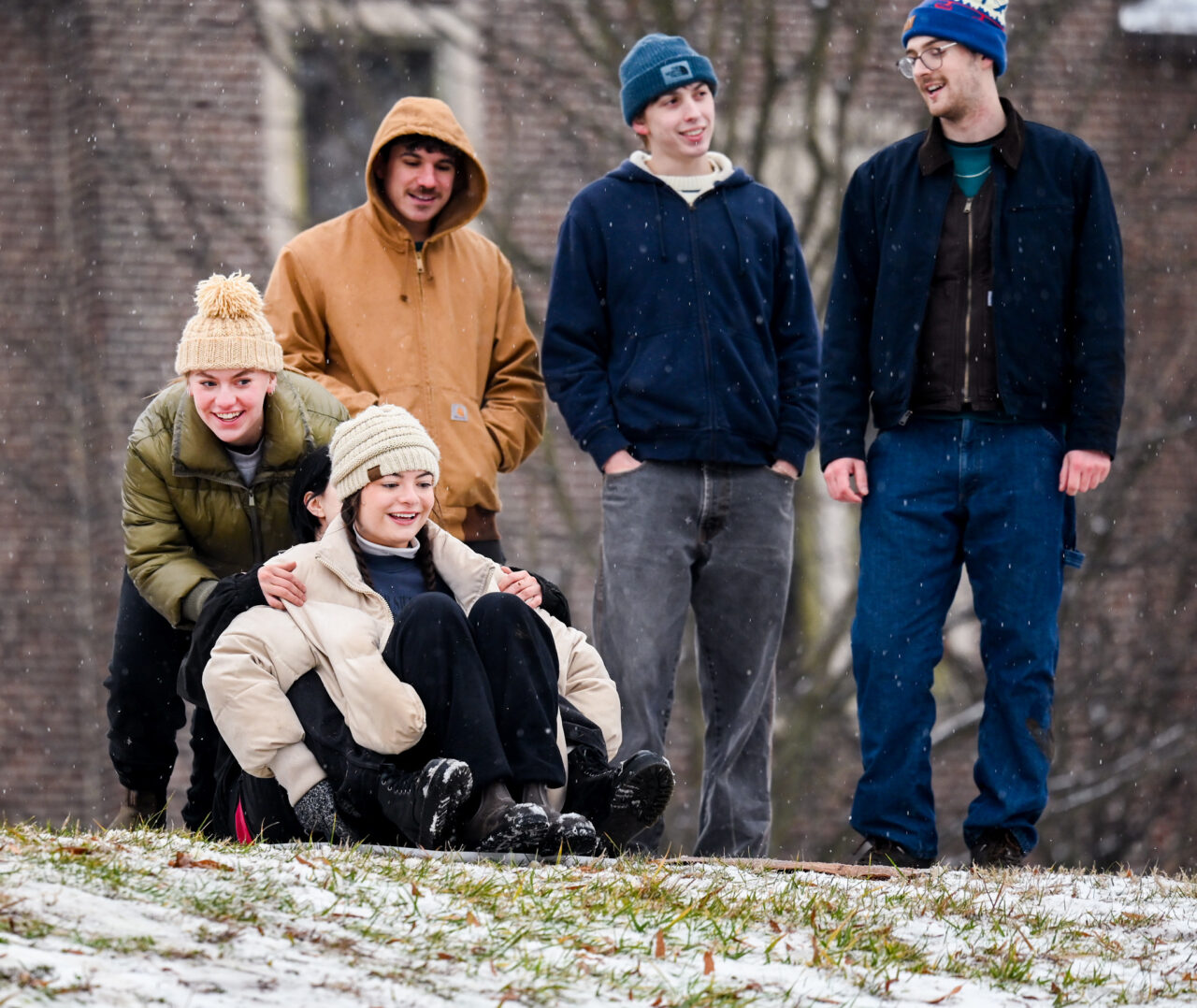 Students play in the snow Monday, Jan. 15, 2024 on Chamberlain Field.