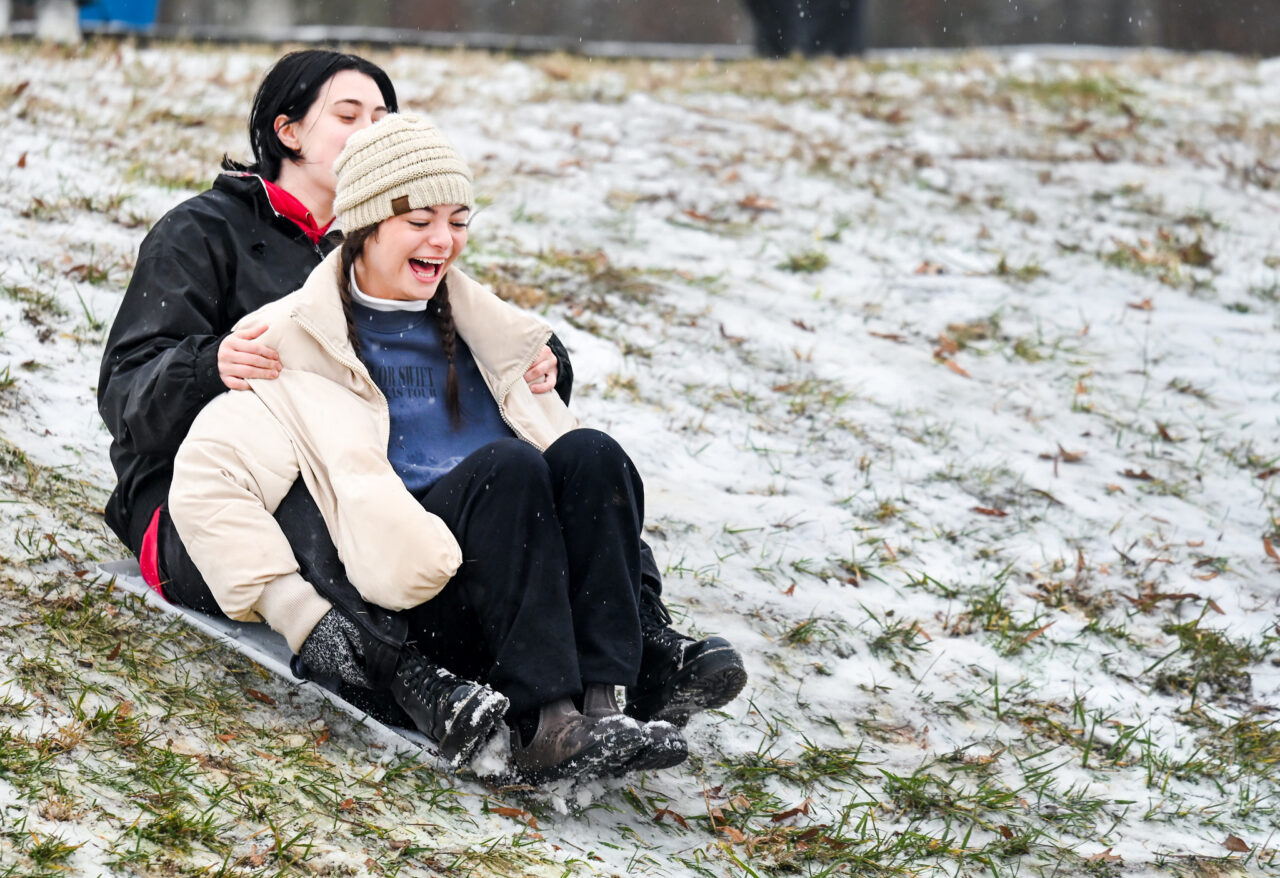 Students play in the snow Monday, Jan. 15, 2024 on Chamberlain Field.