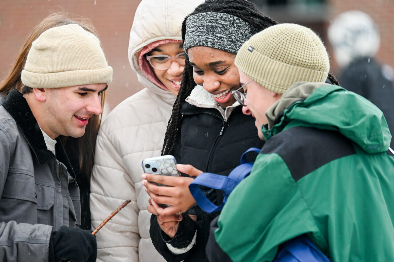 Students play in the snow Monday, Jan. 15, 2024 on Chamberlain Field.