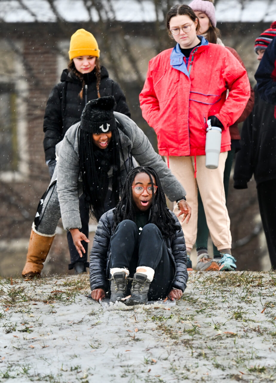 Students play in the snow Monday, Jan. 15, 2024 on Chamberlain Field.