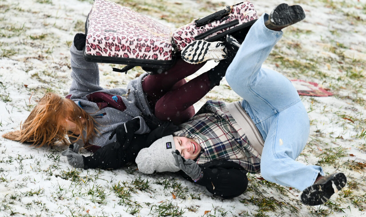 Students play in the snow Monday, Jan. 15, 2024 on Chamberlain Field.