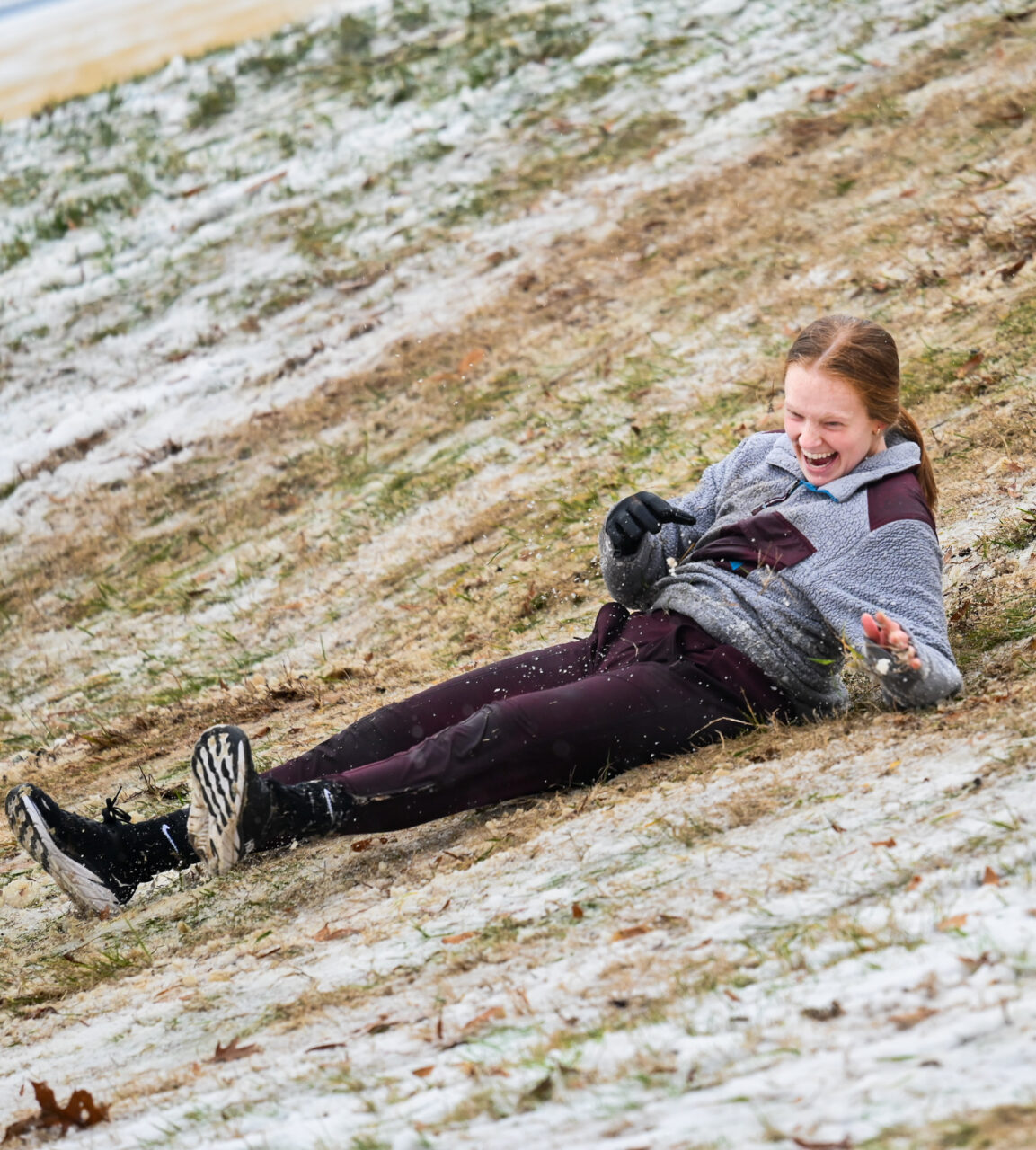 Students play in the snow Monday, Jan. 15, 2024 on Chamberlain Field.