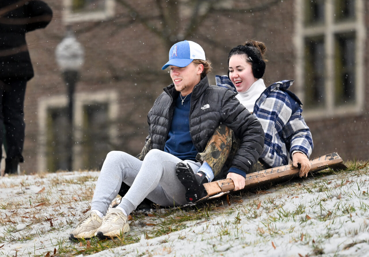 Students play in the snow Monday, Jan. 15, 2024 on Chamberlain Field.