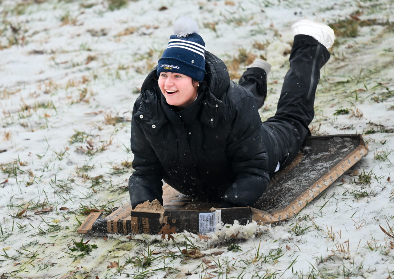 Students play in the snow Monday, Jan. 15, 2024 on Chamberlain Field.