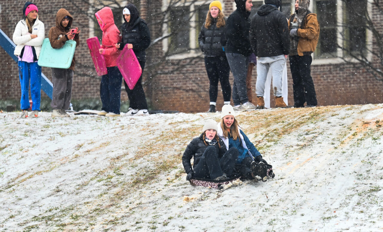 Students play in the snow Monday, Jan. 15, 2024 on Chamberlain Field.