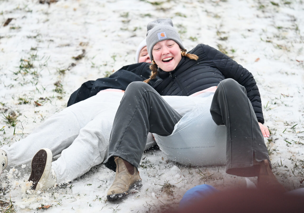 Students play in the snow Monday, Jan. 15, 2024 on Chamberlain Field.