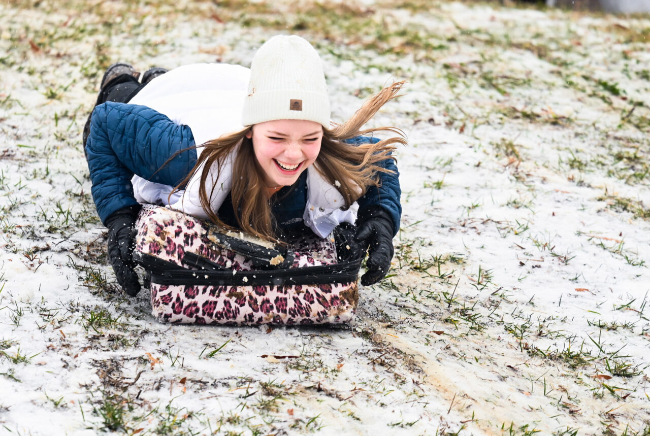 Students play in the snow Monday, Jan. 15, 2024 on Chamberlain Field.