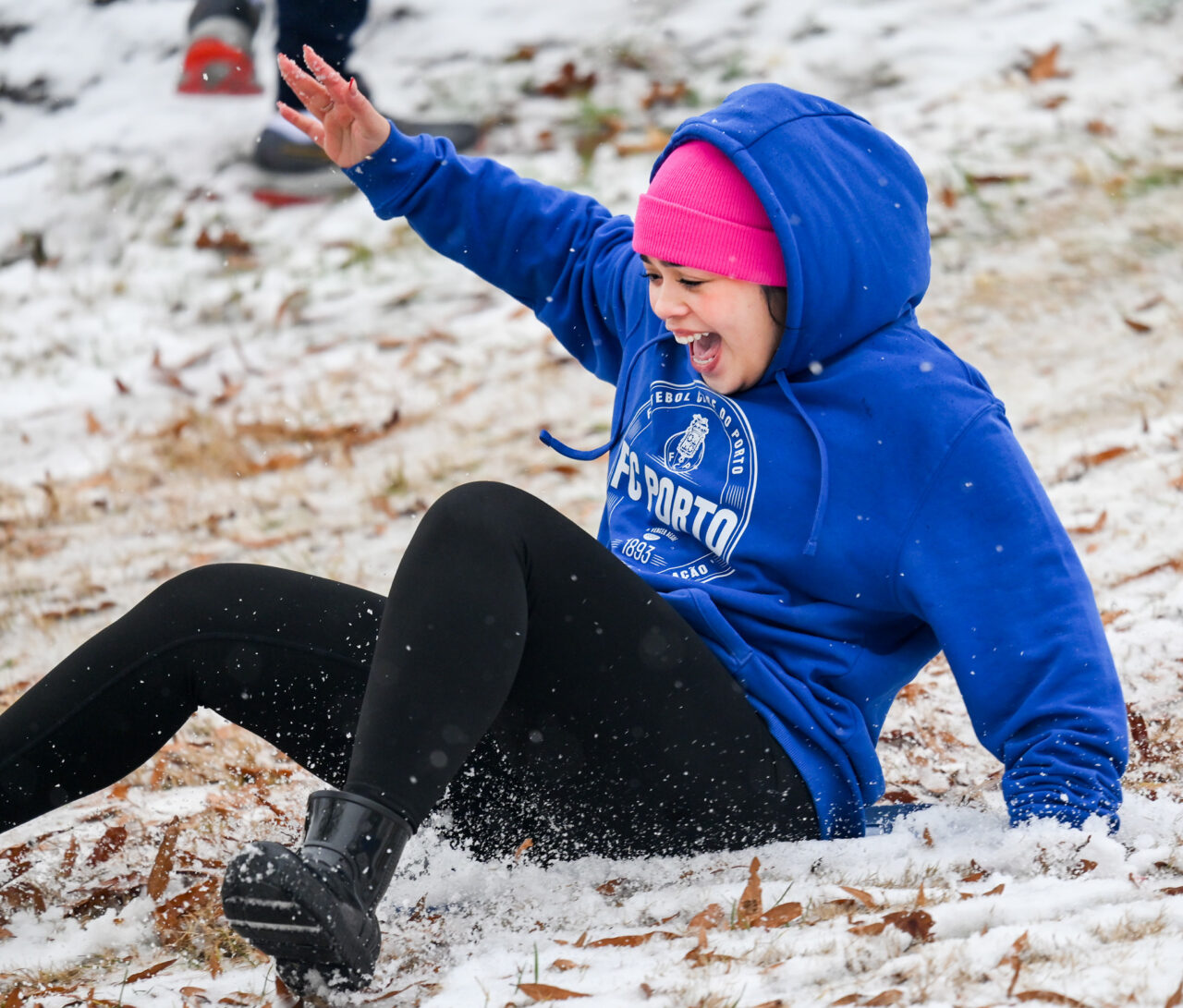Students play in the snow Monday, Jan. 15, 2024 on Chamberlain Field.