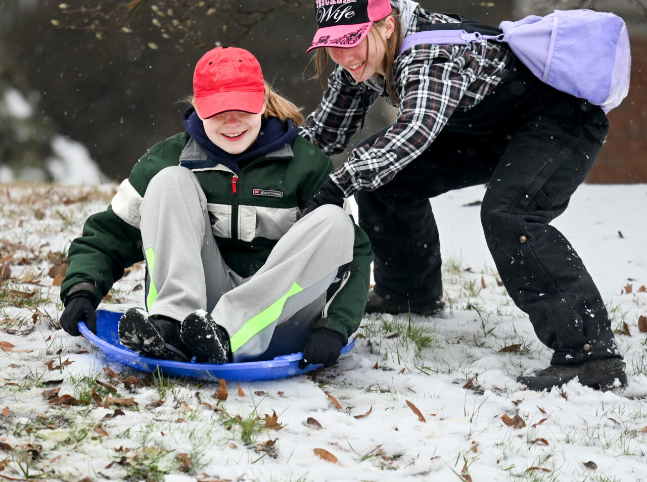Students play in the snow Monday, Jan. 15, 2024 on Chamberlain Field.