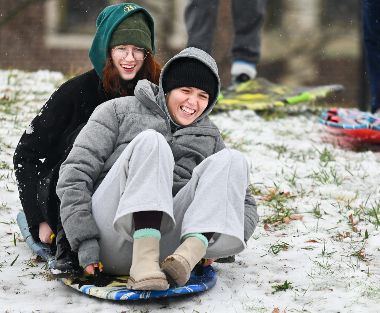 Students play in the snow Monday, Jan. 15, 2024 on Chamberlain Field.