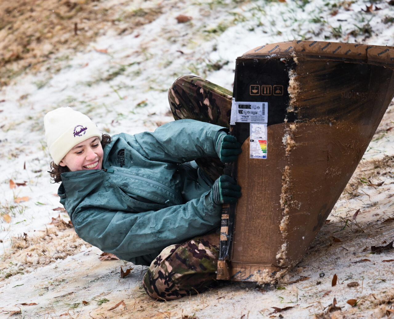 Students play in the snow Monday, Jan. 15, 2024 on Chamberlain Field.