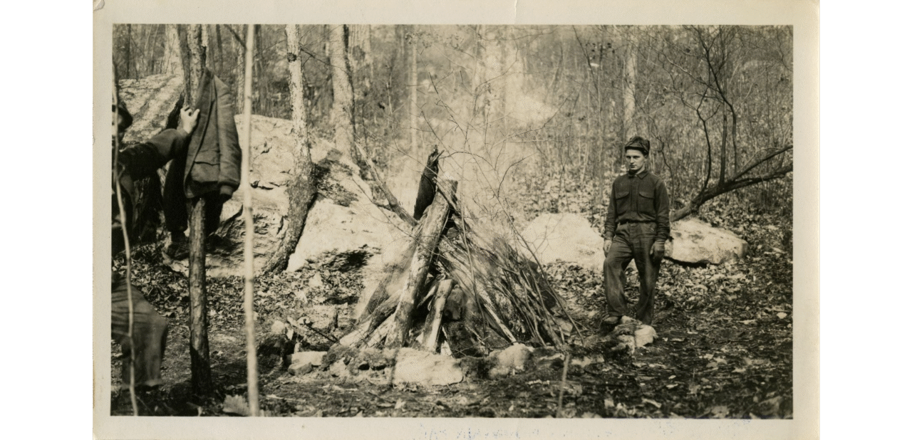 Black-and-white photograph of two workers tending a bonfire in a Lookout Mountain forest from the 1930s. Photo courtesy of University of Tennessee at Chattanooga Special Collections.