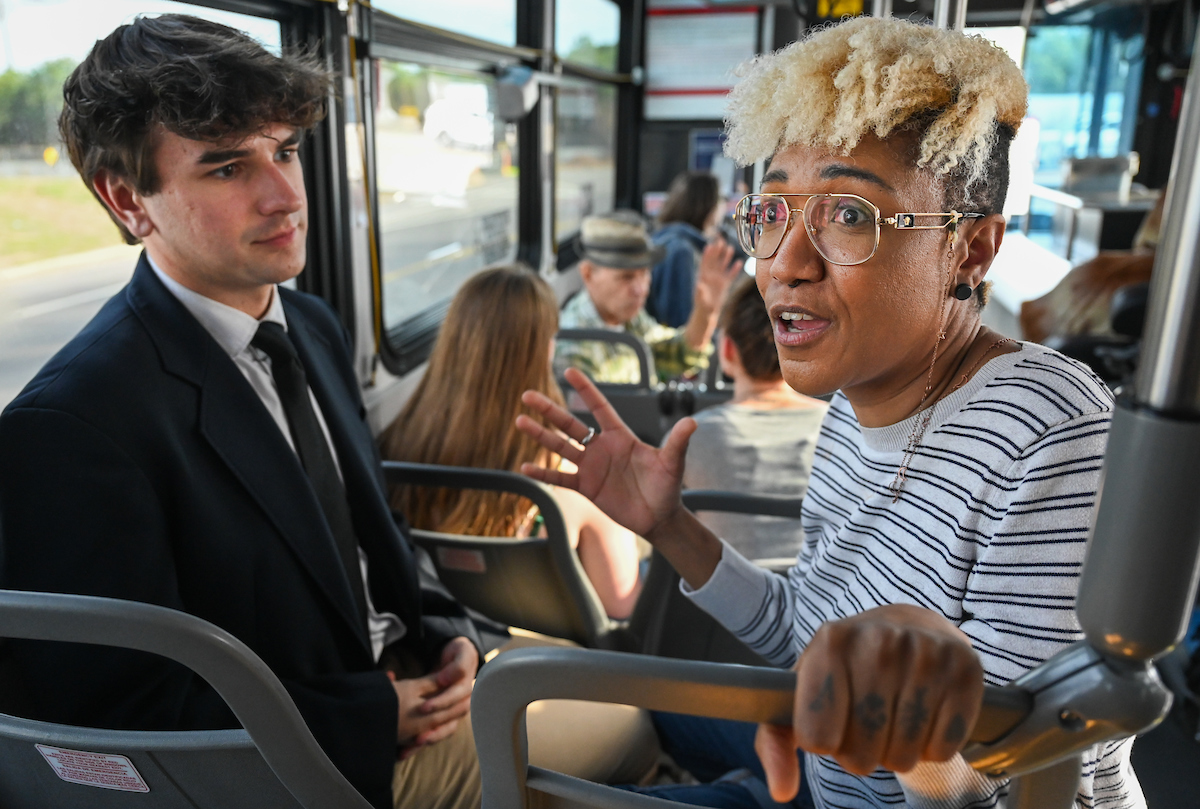 Dr. Chandra Ward, right, leads a UTC Sociology Club discussion during a CARTA bus tour of Chattanooga on Feb. 26.