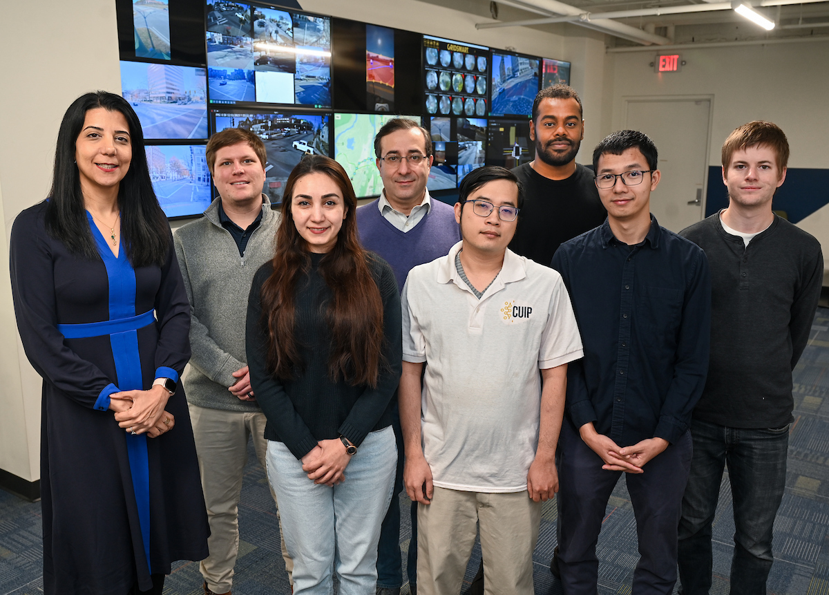Members of the UTC Center for Urban Informatics and Progress team include: top row from left Dr. Mina Sartipi, Director of Operations/Chief Engineer Austin Harris, graduate students Mehdi Khaleghian and Yasir Hassan; bottom row from left, graduate students Sima Ashayar, Tuan Nguyen and Giang Do and Junior High Performance Computing Tech Patrick Bigelow. Photo by Angela Foster.