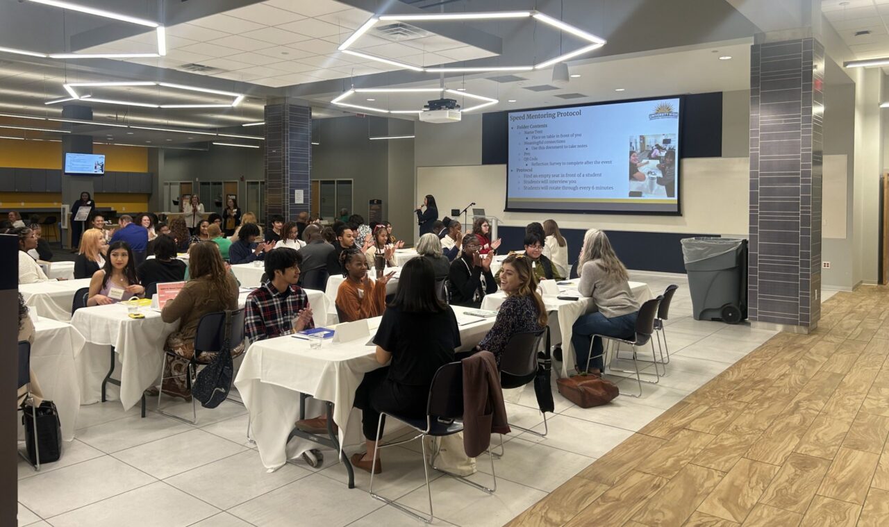 University High students speak with their mentors in Lupton Hall. Photo by Kali Glover.