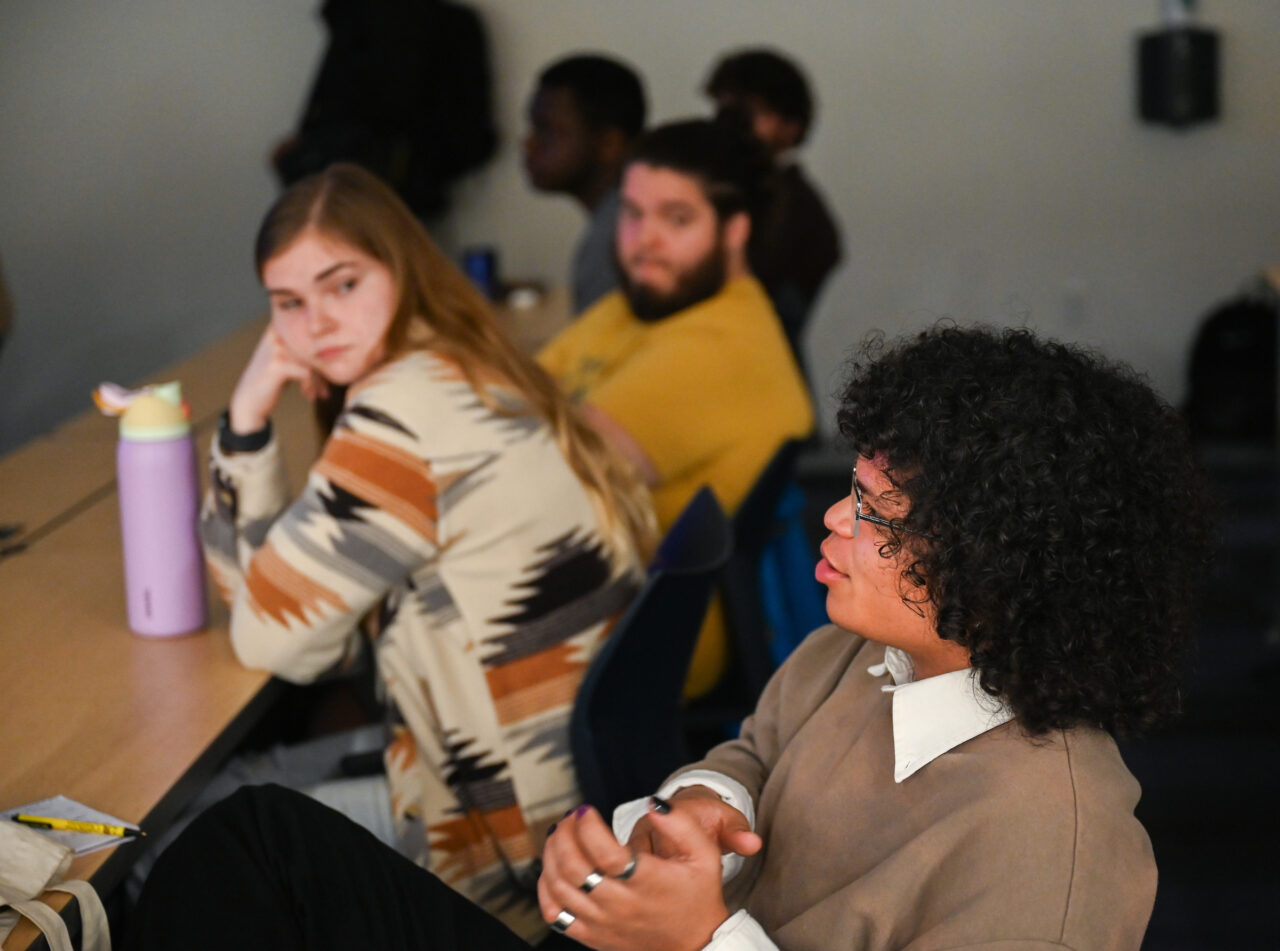 Students, staff, faculty and community members attend Photo Night Wednesday, Mar. 6, 2024 in the Roland Hayes Concert Hall.
