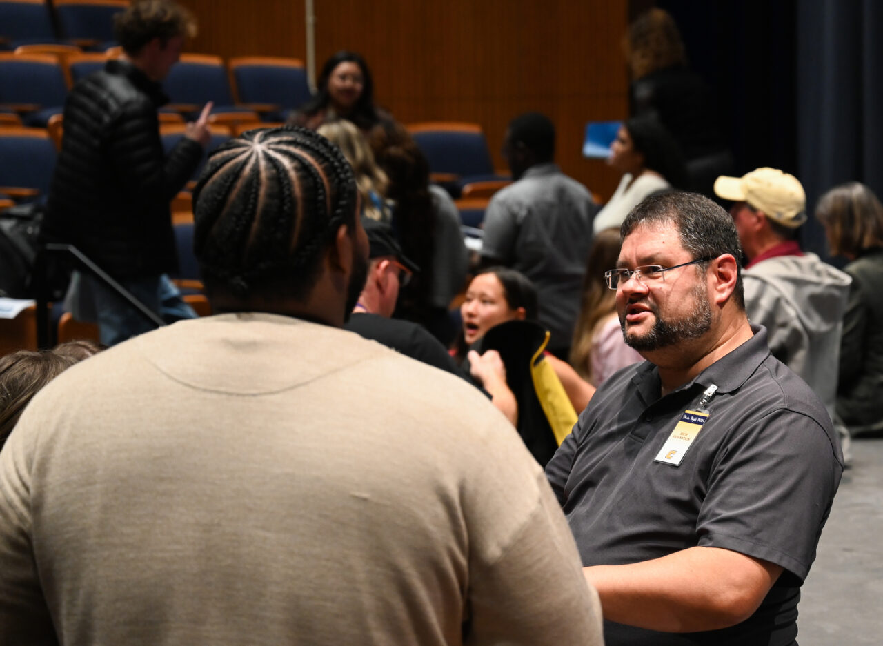 Students, staff, faculty and community members attend Photo Night Wednesday, Mar. 6, 2024 in the Roland Hayes Concert Hall.
