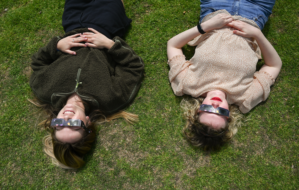 Students watch the eclipse Monday, April 8, 2024 on Chamberlain Field.