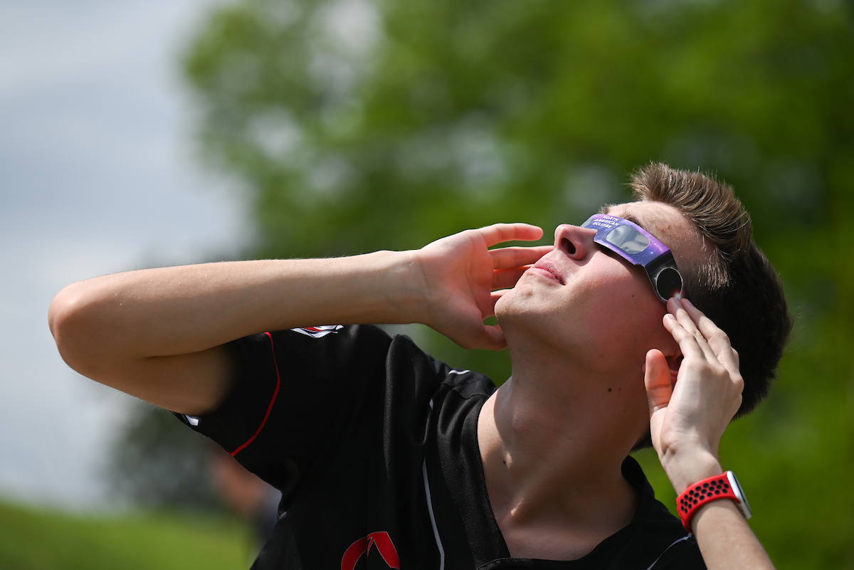 Students watch the eclipse Monday, April 8, 2024 on Chamberlain Field.