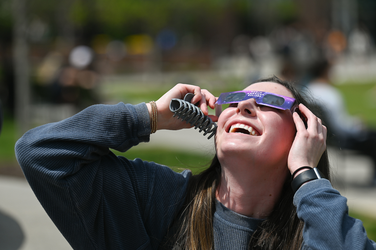 Students watch the eclipse Monday, April 8, 2024 on Chamberlain Field.