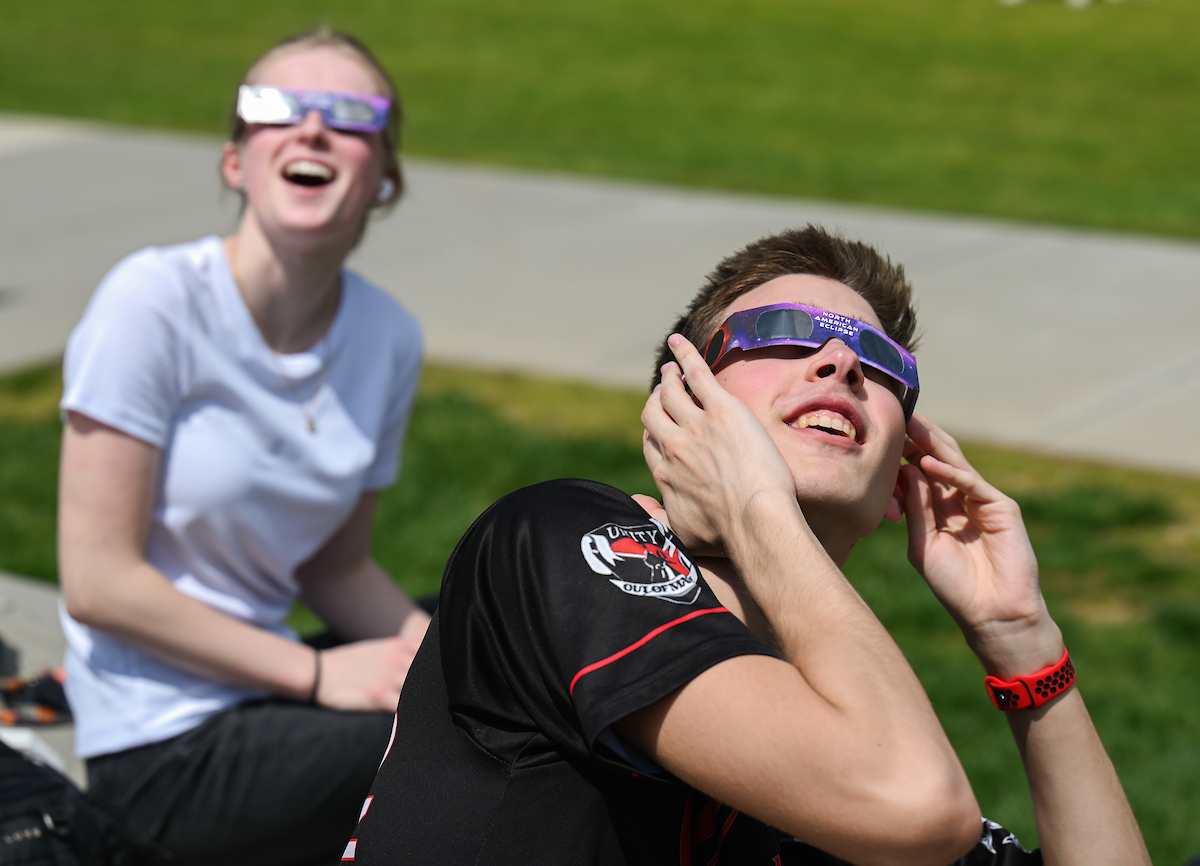 Students watch the eclipse Monday, April 8, 2024 on Chamberlain Field.