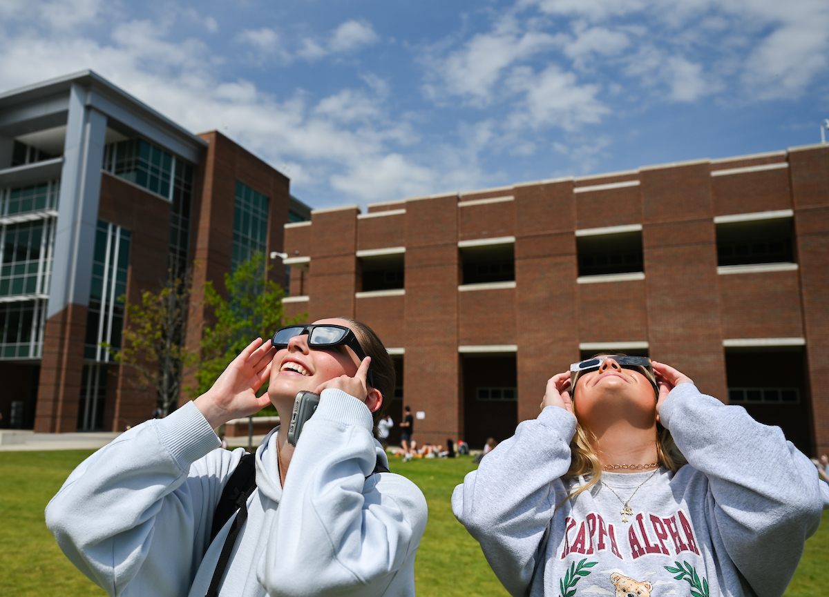 Students watch the eclipse Monday, April 8, 2024 on Chamberlain Field.