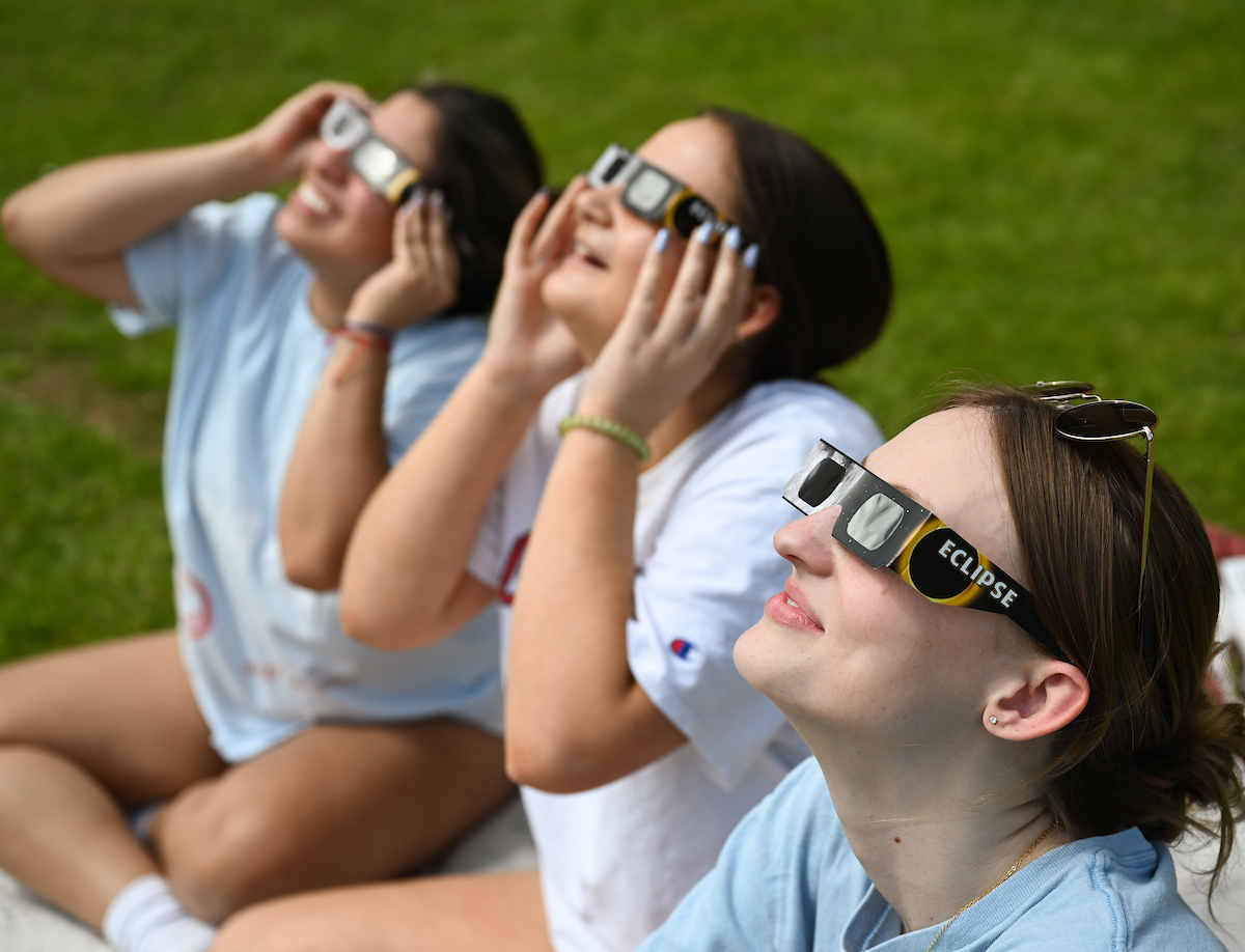 Students watch the eclipse Monday, April 8, 2024 on Chamberlain Field.
