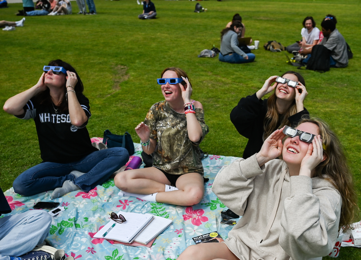 Students watch the eclipse Monday, April 8, 2024 on Chamberlain Field.