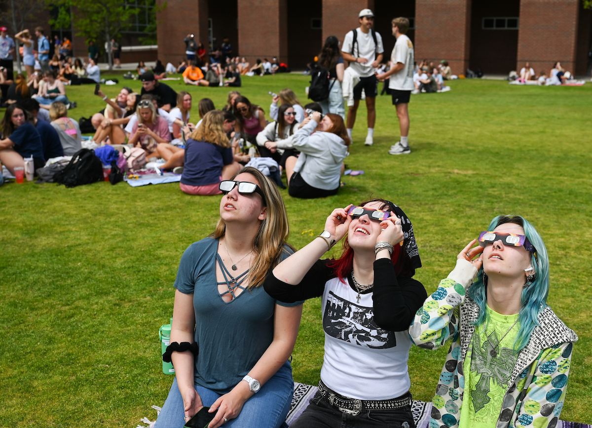 Students watch the eclipse Monday, April 8, 2024 on Chamberlain Field.