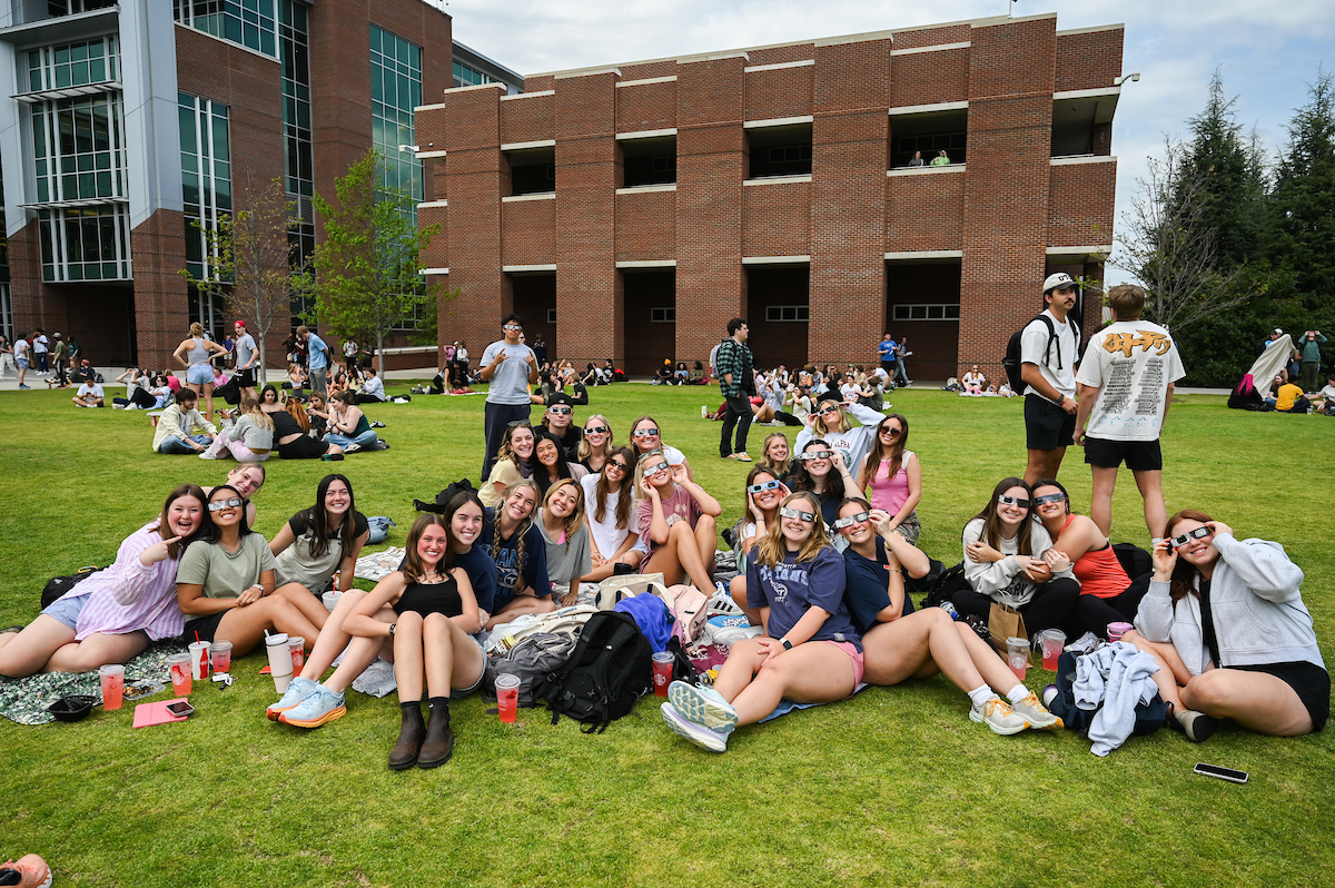 Students watch the eclipse Monday, April 8, 2024 on Chamberlain Field.
