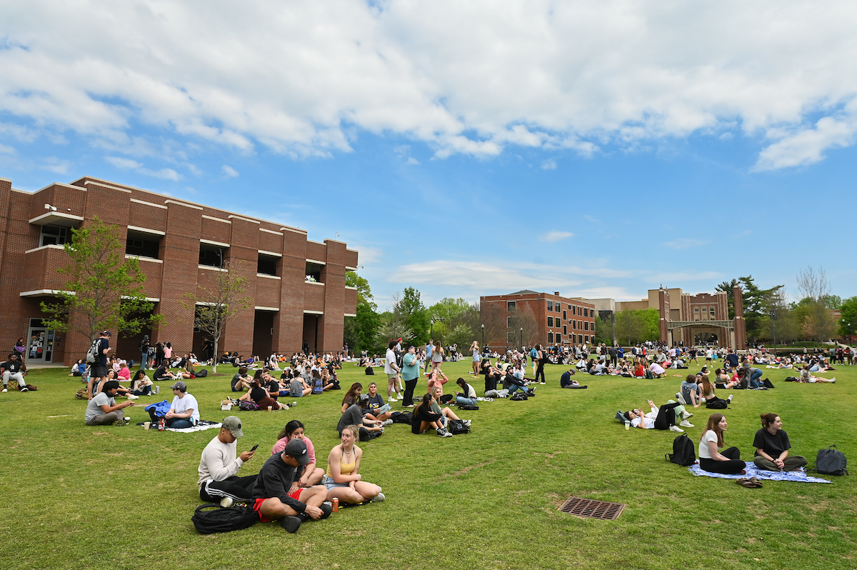 Students watch the eclipse Monday, April 8, 2024 on Chamberlain Field.