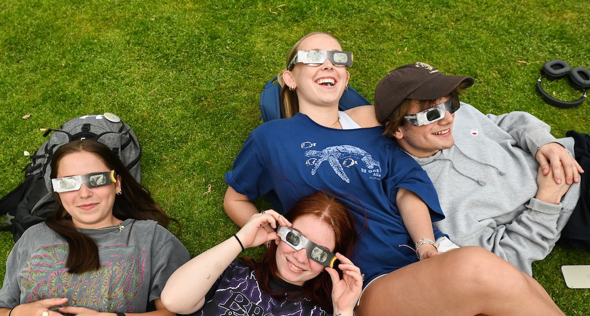 Students watch the eclipse Monday, April 8, 2024 on Chamberlain Field.