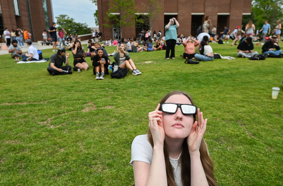 Students watch the eclipse Monday, April 8, 2024 on Chamberlain Field.