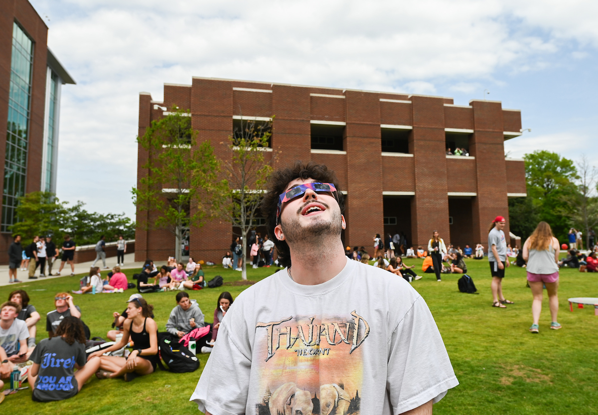 Students watch the eclipse Monday, April 8, 2024 on Chamberlain Field.