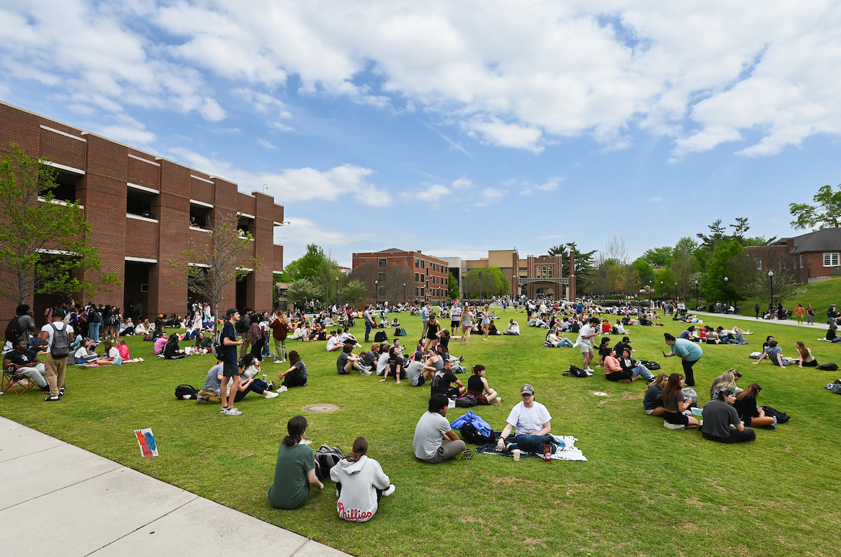 Students watch the eclipse Monday, April 8, 2024 on Chamberlain Field.