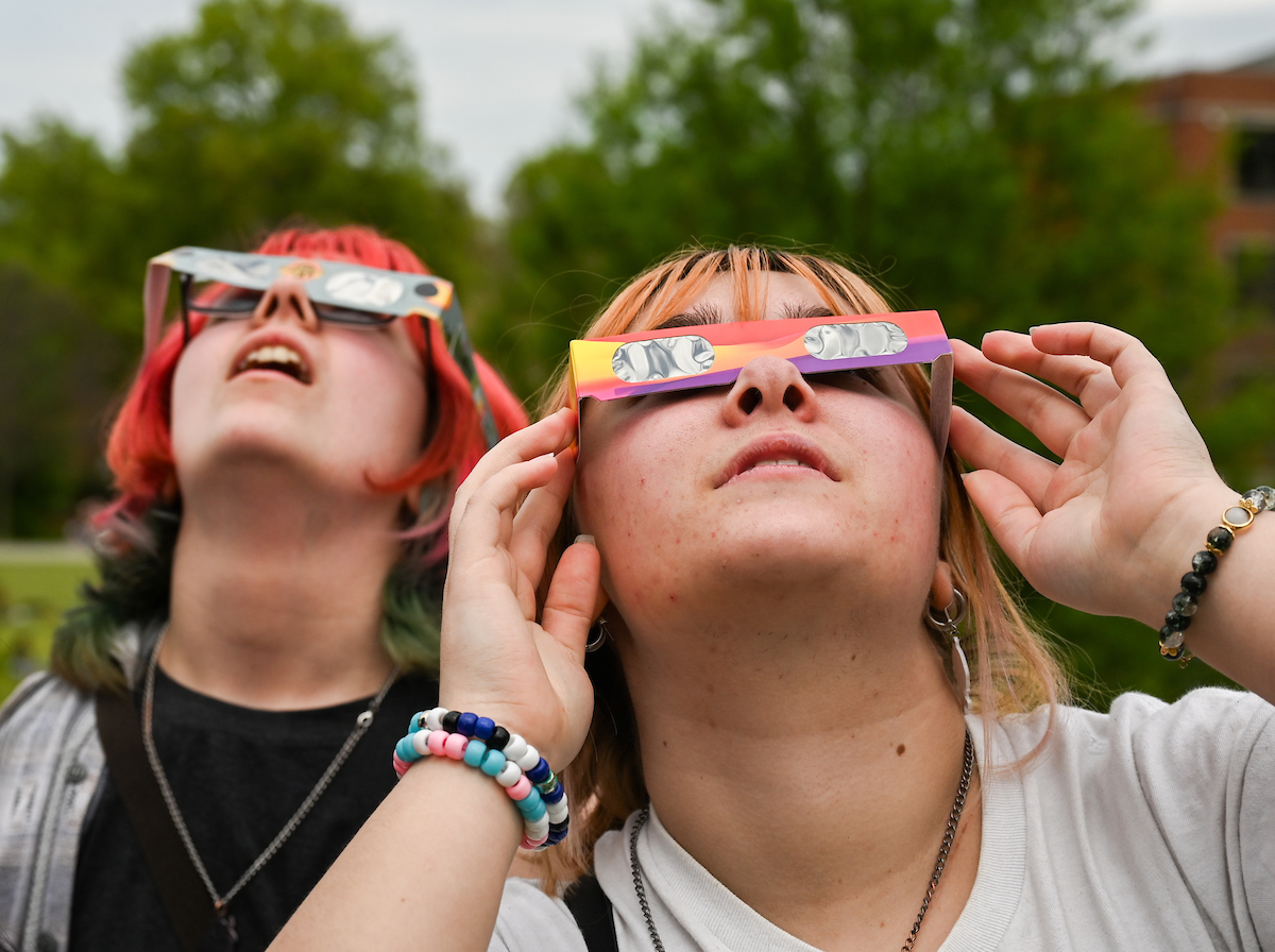 Students watch the eclipse Monday, April 8, 2024 on Chamberlain Field.