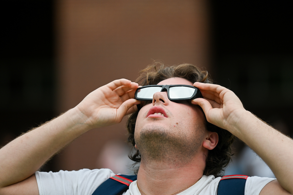 Students watch the eclipse Monday, April 8, 2024 on Chamberlain Field.