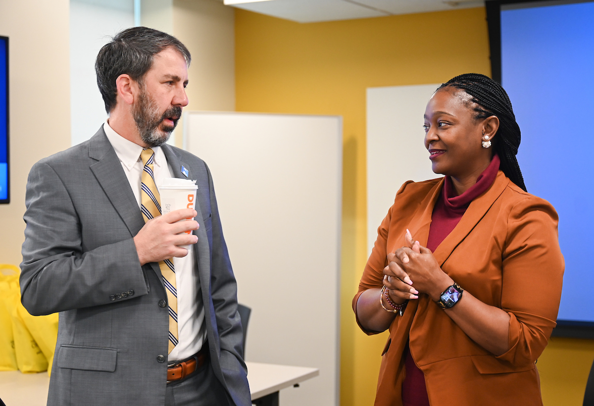 Hamilton County Schools Superintendent Justin Robertson, left, and UTC Chancellor Steven Angle sign an MOU Wednesday, April 3, 2024 in Hunter Hall on the University of Tennessee at Chattanooga campus.