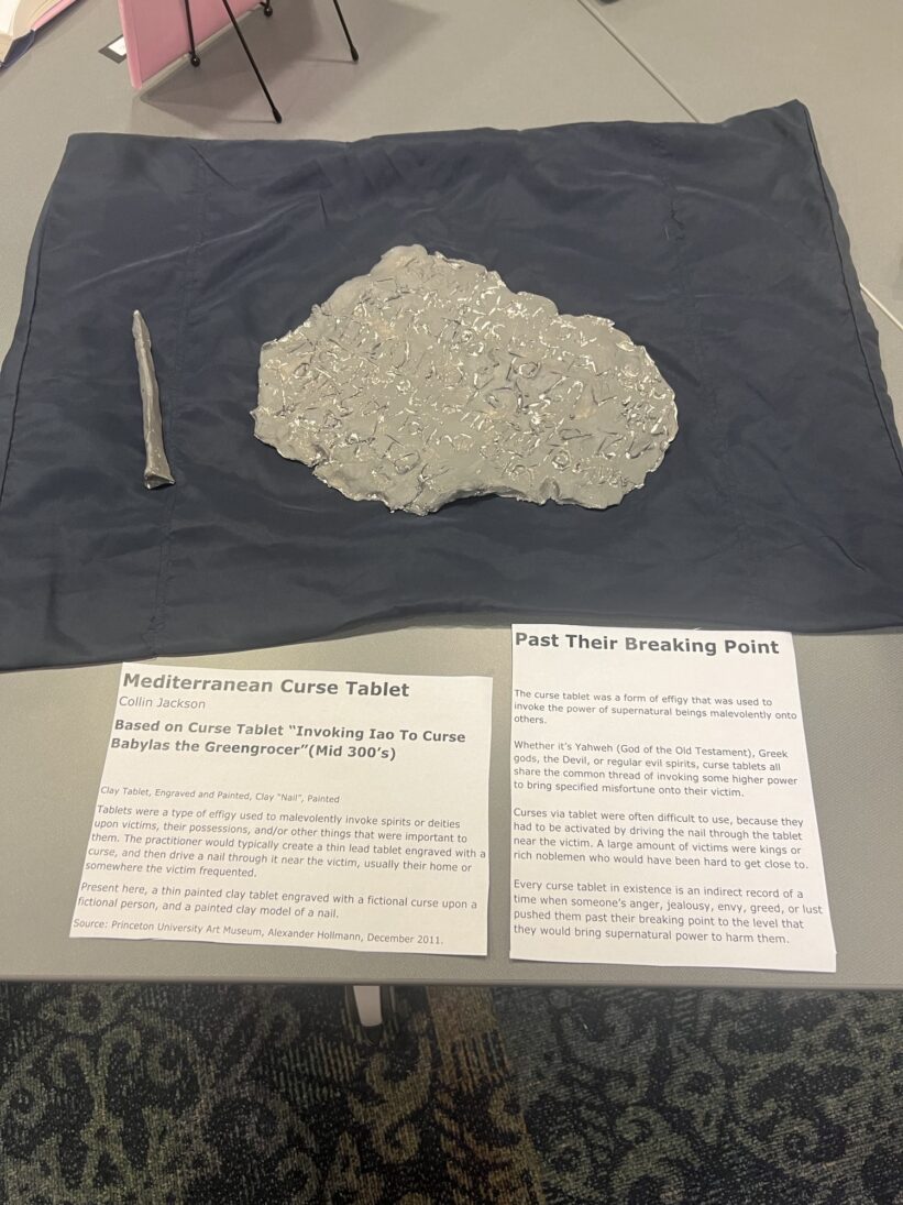 Freshman Collin Jackson's model of a curse tablet was one of the "Tools of the Trade" displayed by Dr. Kira Robison's "Medieval Magic and Medicine" course.