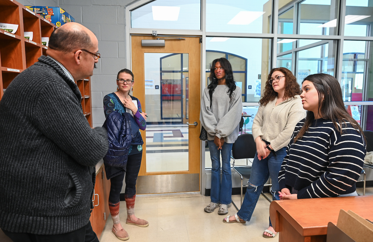 UTC Lecturer of Spanish Brandee Strickland, second from left, and students Bradley Jellow, Caroline Colvin and Aracely Angel observed and assisted interpreter Gabriel Negrete Regagnon at Orchard Knob Elementary School's parent/teacher conferences on Thursday, March 28. Photo by Angela Foster.