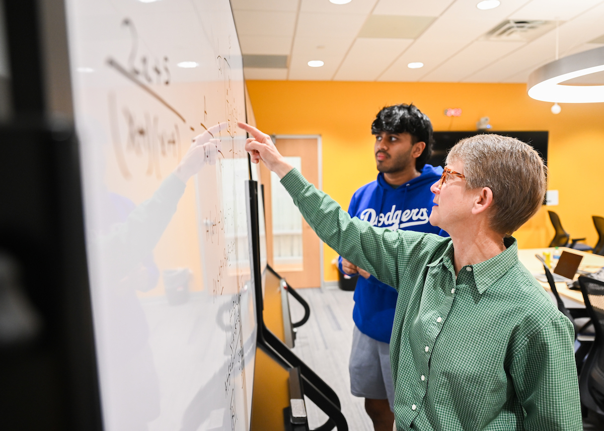 Meg Kiessling works with students on Thursday, April 18, in Lupton Hall. Photo by Angela Foster.