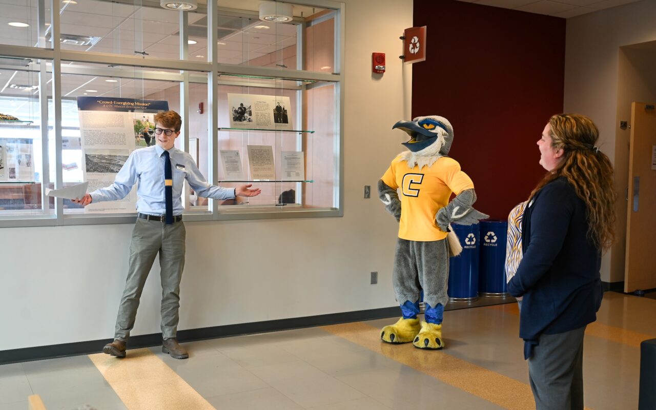University Archivist Noah Lasley and Scrappy sharing mascot history with event attendees on April 3, 2024, in the UTC Library. Photo by Angela Foster.