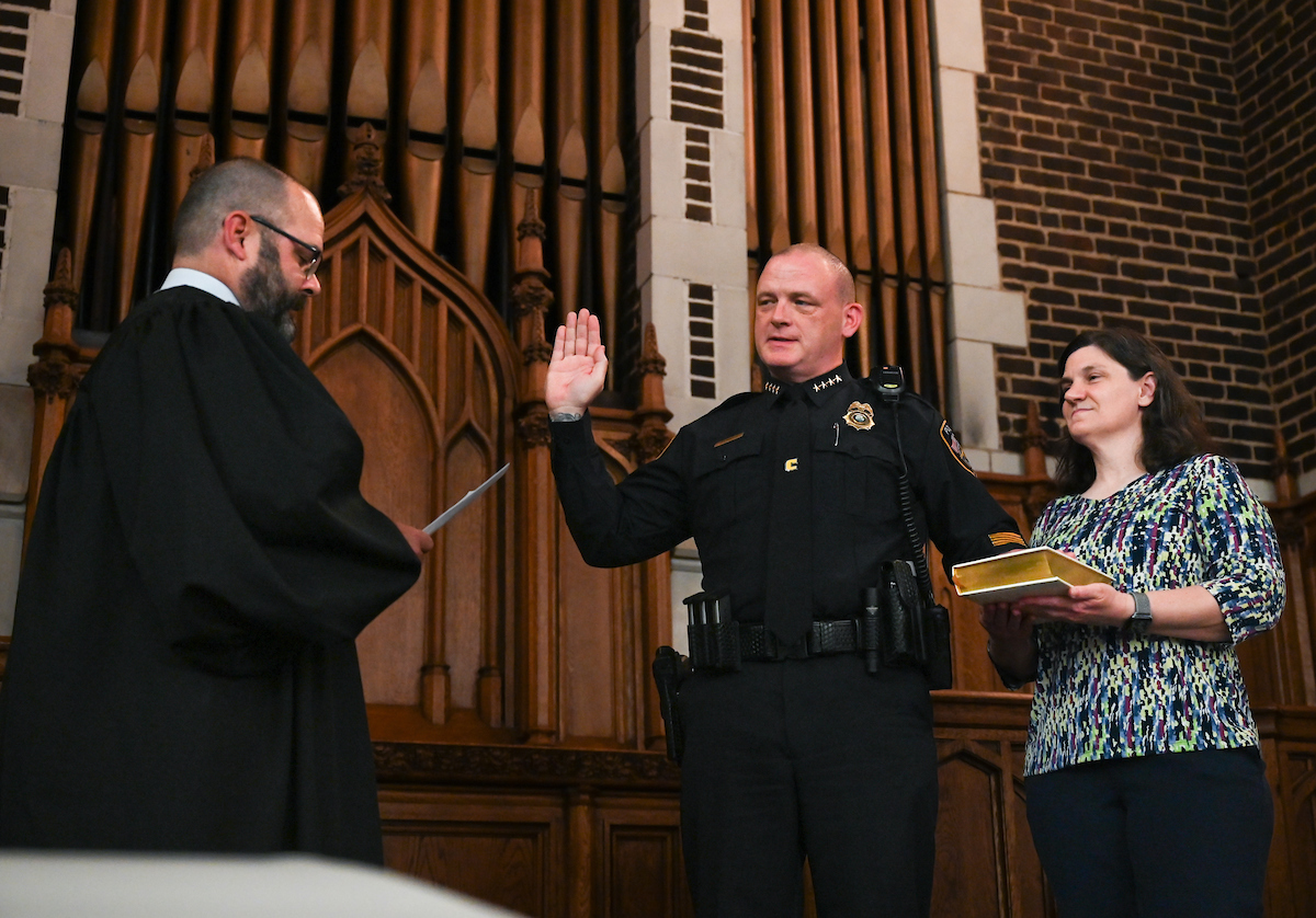 Police Chief Sean O’Brien is sworn in by the Honorable Travis R. McDonough, chief judge of the U.S. District Court for the Eastern District of Tennessee, on Friday, May 10, in Patten Chapel. The bible holder was O’Brien’s wife, Janet. Photo by Noah Camacho.