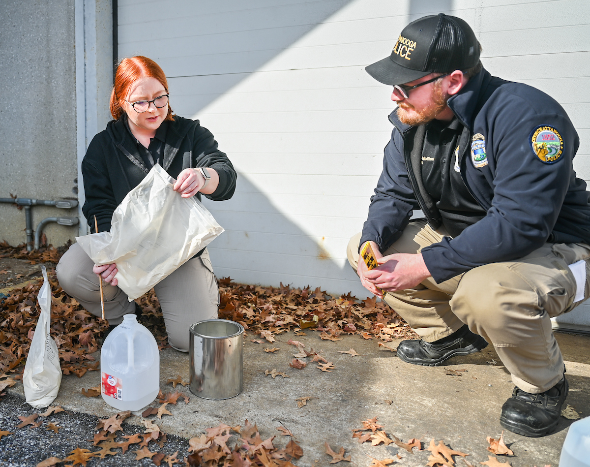 Graciela Williams (left) learns how to do crime scene footprint casting at the Chattanooga Police Department. Photo by Angela Foster.