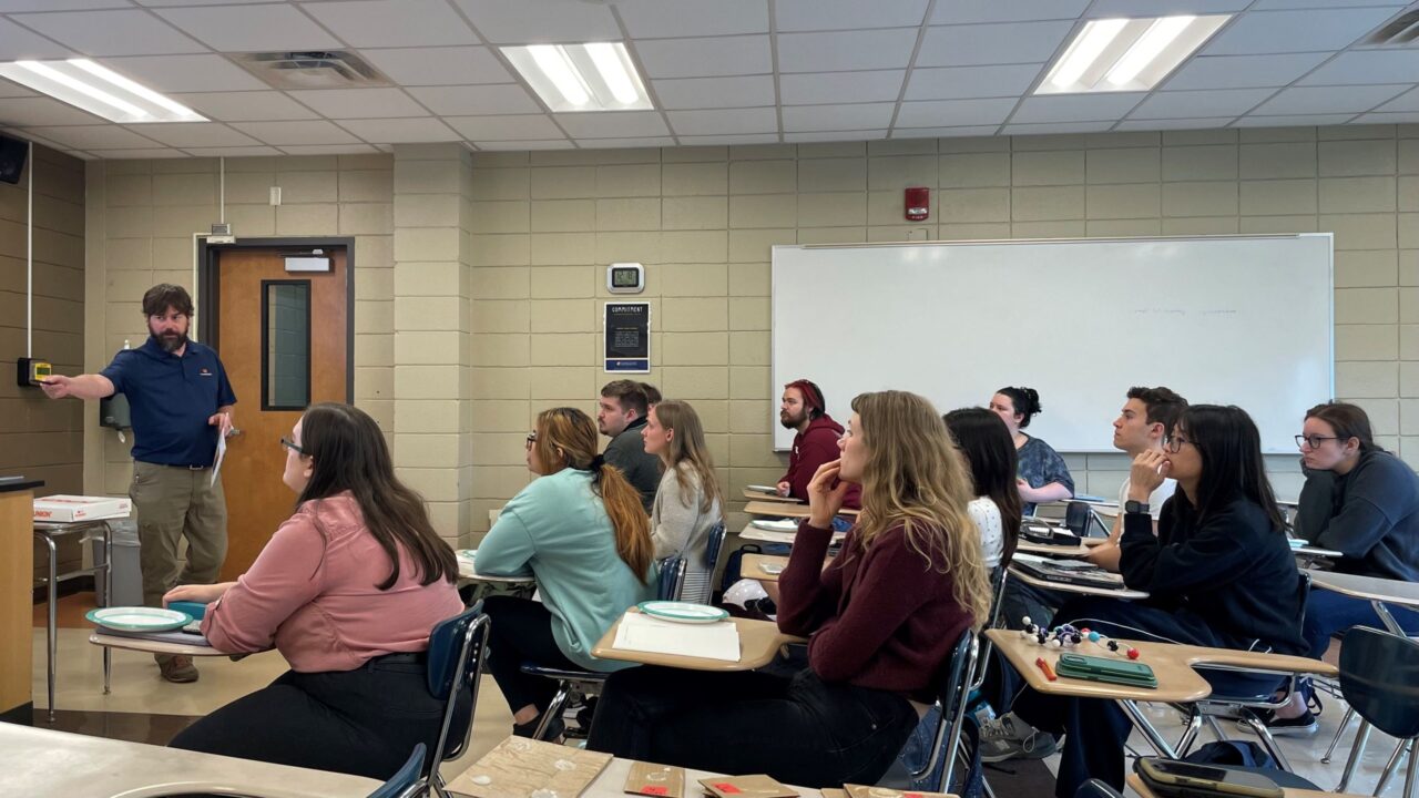 Woodbridge Senior Development Chemist Carlisle Glover addresses the UTC polymer chemistry class. Photo credit: Dr. Meredith Barbee.