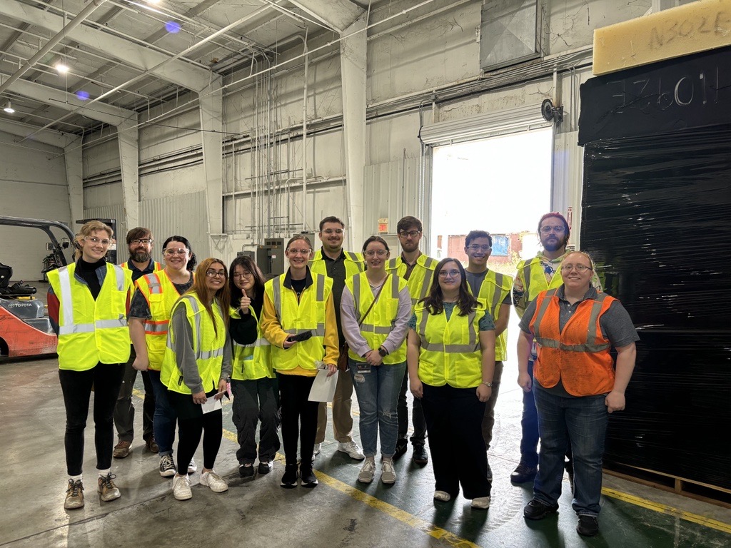 The polymer chemistry students wore safety vests and glasses to tour the Chattanooga site. Carlisle Glover is in the back. Kaitlyn Cathers is in orange.