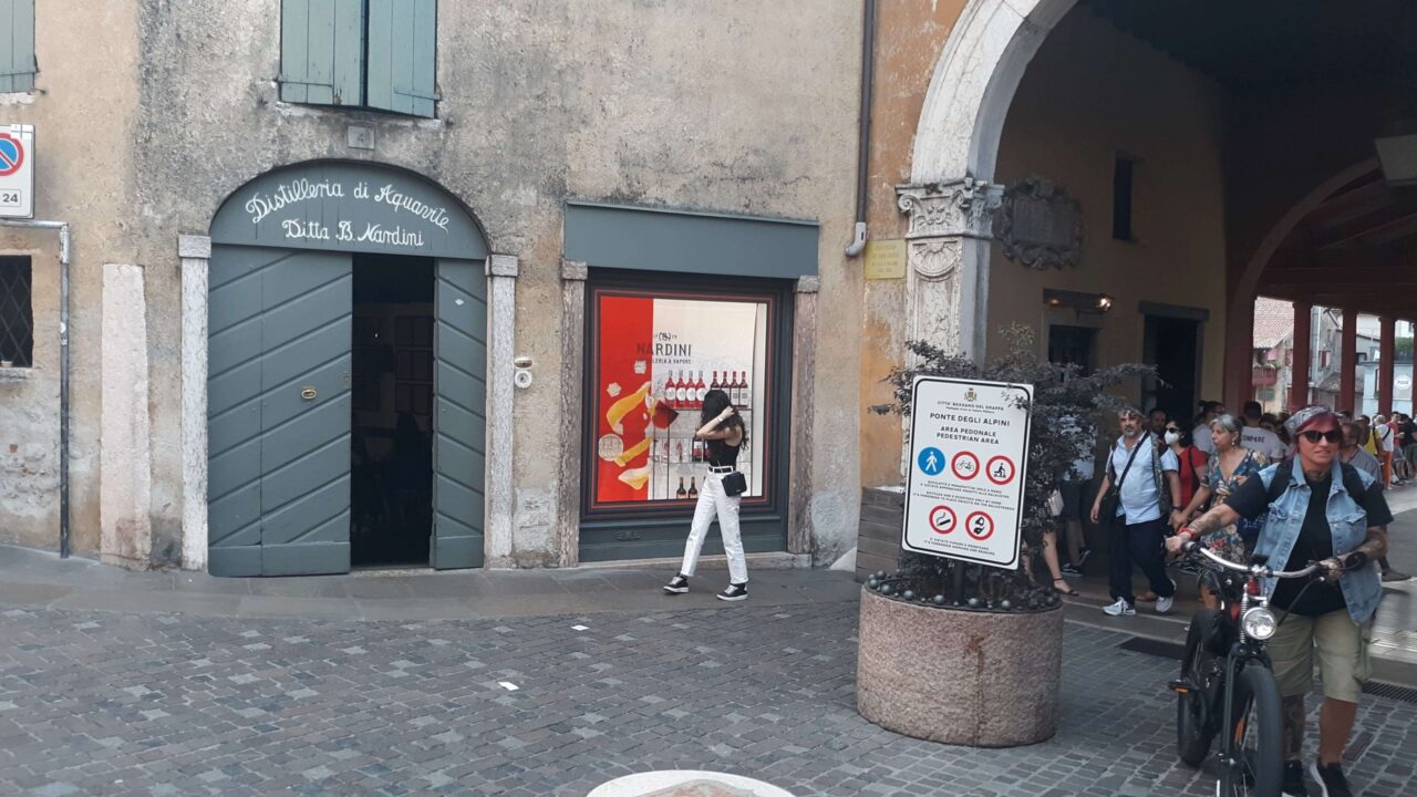 Bassano is home of grappa, a beverage of high alcohol content made from fermented grapes and grape stems. The Nardini grapperia on the east end of the covered bridge was a frequented by both Dos Passos and Ernest Hemingway during their stays in Bassano.