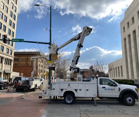 Chattanooga Department of Transportation workers install lidar devices at the intersection of M.L. King Boulevard and Georgia Avenue.