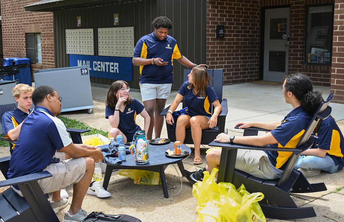 Housing and Residence Life employees sit, Monday, Aug. 12, 2024 outside of Lockmiller.