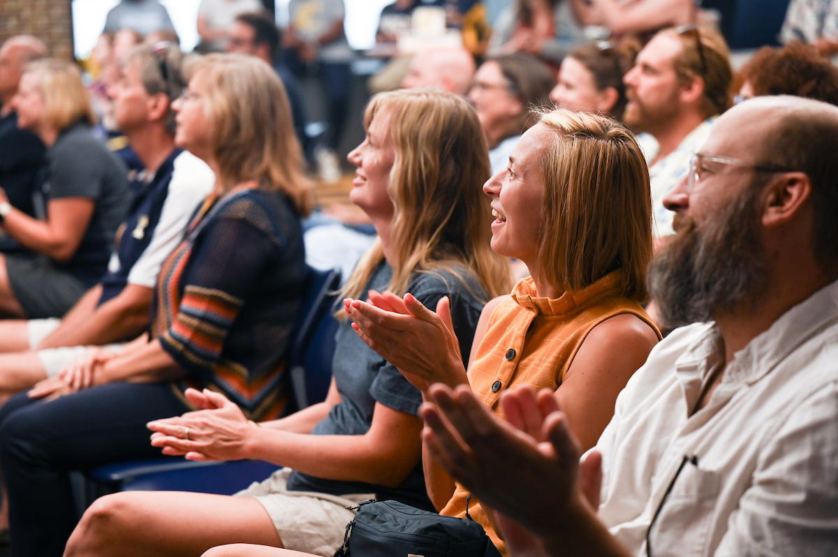 Staff, faculty and students gather Friday, Aug. 9, 2024 in the University Center to watch student Olivia Reeves compete for gold in the Olympics snatch and clean and jerk weightlifting event.
